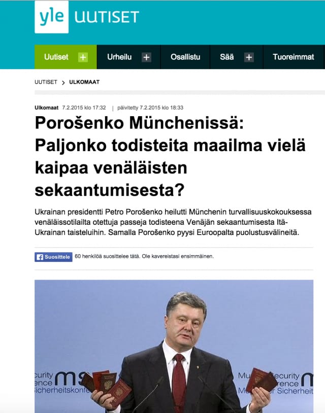 Yle nosti esiin suoraan Reutersin uutisen. Kuvakaappauksessa Ukrainan presidentti Petro Porošenko pitää kädessään venäläisiä passeja.