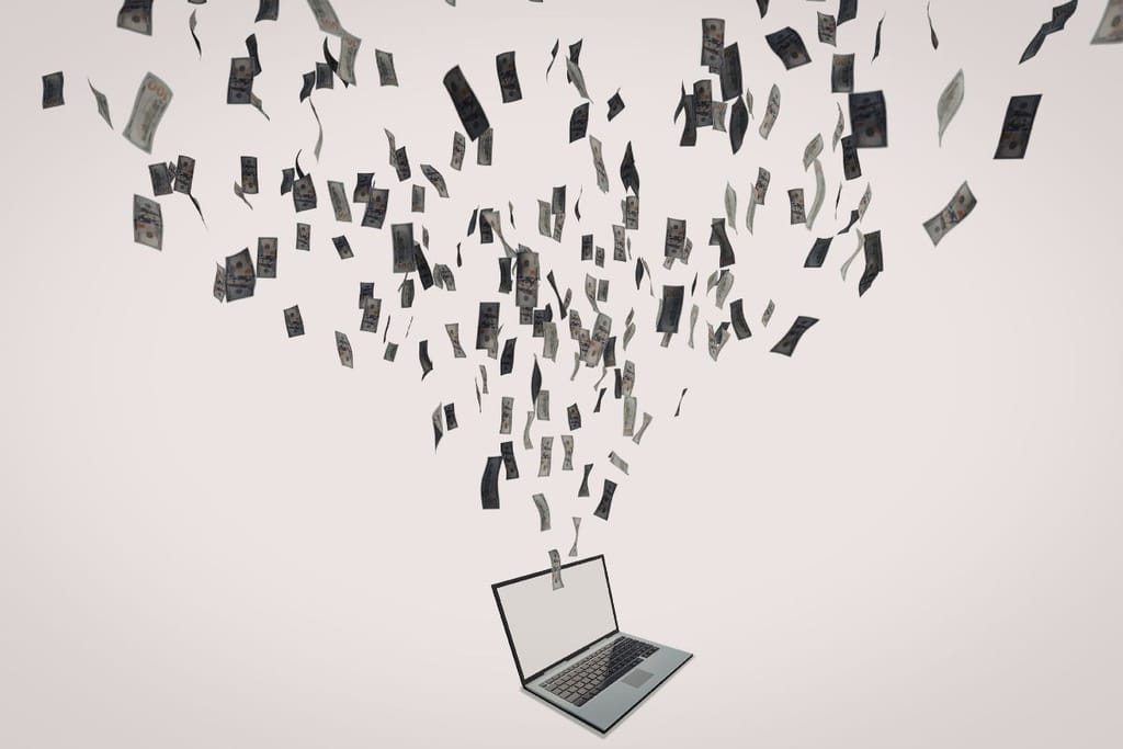 Kannettava tietokone, jonka yläpuolella leijuu ja putoilee seteleitä.