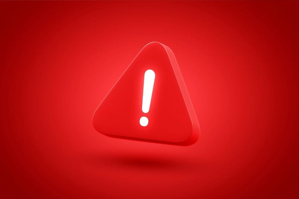 Punainen varoituskolmio huutomerkillä