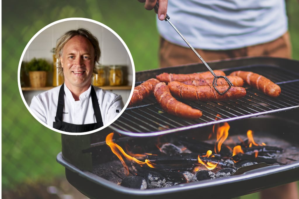 Taustalla henkilö paistaa makkaraa grillissä. Edessä Kape Aihinen.